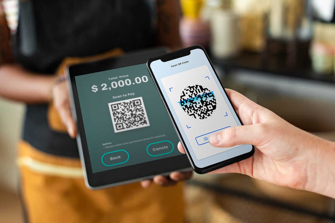 Scanning QR code to pay at a restaurant POS